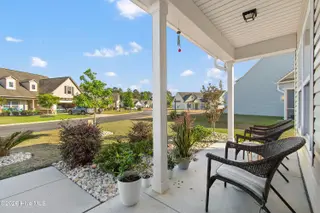 587 Meadowbrook Lane NW, Calabash, NC 28467 – photo 9: Open Porch