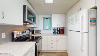 8801 Reed Drive 115, Emerald Isle, NC 28594 – photo 8: Kitchen w/ New Maytag Appliances