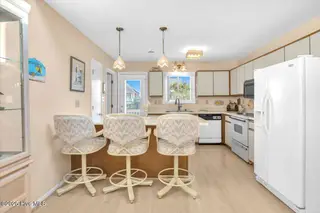 1708 W Beach Drive, Oak Island, NC 28465 – photo 11: 10-Final 1708 W Beach Dr OKI-RJREM-1826