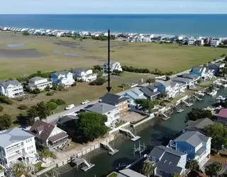 147 Swordfish Drive, Holden Beach, NC 28462 — 5-bedroom home, Holden Beach, NC, photo 10 of 12: rear canal view