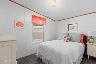 7203 Banner Street SW, Ocean Isle Beach, NC 28469 — 3-bedroom manufactured home in Seaside Heights, Ocean Isle Beach, NC, photo 17 of 38: Secondary Bedroom