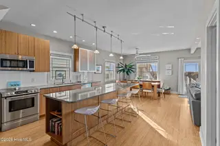7403 E Beach Drive, Oak Island, NC 28465 – photo 10: Open-Concept Kitchen & Dining