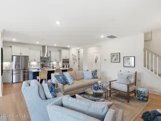 9251 Salty Breeze Place, Leland, NC 28451 — 5-bedroom home in Grand Park, Leland, NC, photo 12 of 42: Great Room to Kitchen