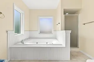 2801 Pier Pointe Drive B2, Emerald Isle, NC 28594 – photo 19: Primary Suite with Walk-in Shower, Tub