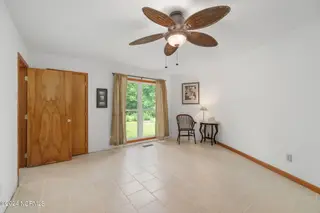 335 Country Club Lane, Newport, NC 28570 – photo 7: First floor primary bedroom suite