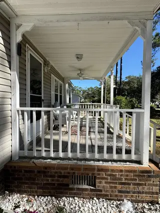 211 Beachwood Drive NW, Calabash, NC 28467 — 3-bedroom manufactured home in Ocean Forest, Calabash, NC, photo 13 of 75: porch 5