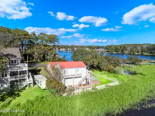 641 Shoreline Drive W, Sunset Beach, NC 28468 – photo 3: DJI_20250107143710_0012_D