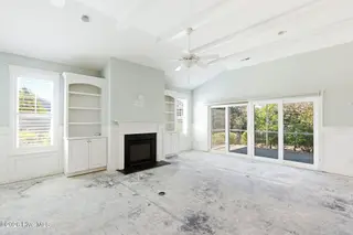 1454 Dunes Boulevard SW, Ocean Isle Beach, NC 28469 – photo 7: Double sliders to the screened porch