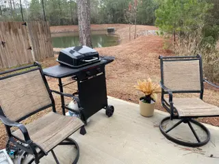 1439 New Sun Drive SE, Bolivia, NC 28422 — 4-bedroom home in Olde Georgetowne, Bolivia, NC, photo 3 of 15: 1439 Back yard pond
