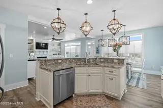 3604 W Pelican Drive, Oak Island, NC 28465 – photo 24: Kitchen into Living Room
