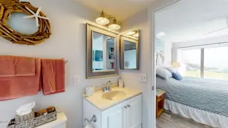8801 Reed Drive 115, Emerald Isle, NC 28594 – photo 16: Primary Bedroom En Suite Vanity