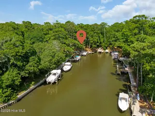 117 White Ash Drive, Pine Knoll Shores, NC 28512 – photo 8: Dock at end of canal