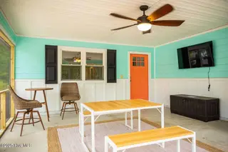 221 NE 58th Street, Oak Island, NC 28465 – photo 16: SCREENED IN PATIO