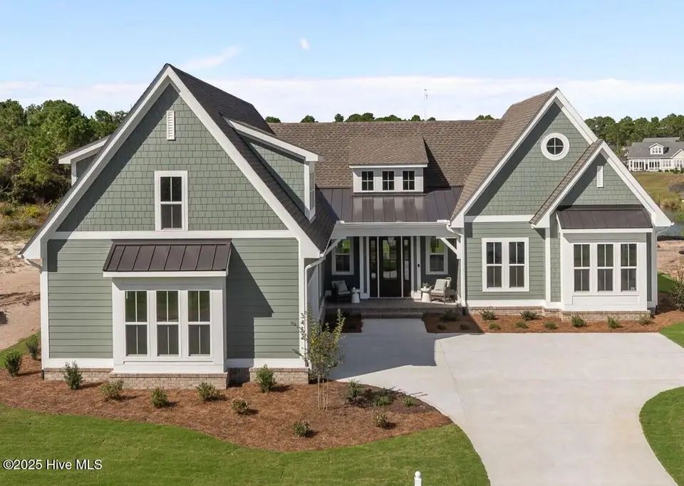 3452 St James Drive SE, Southport, NC 28461 – photo 1 of 59: 1-web-or-mls-DJI_20251006122050_0562_D