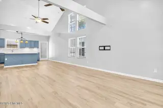 127 NW 19th Street, Oak Island, NC 28465 – photo 10: Open concept Living/dining room