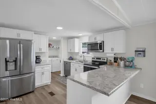 2216 Bell Williams Road, Burgaw, NC 28425 — 3-bedroom manufactured home, Burgaw, NC, photo 7 of 25: Kitchen – Ample Storage and Workspace