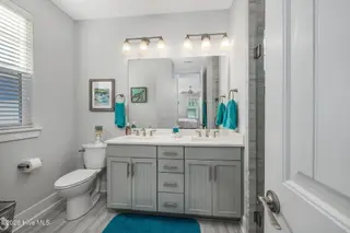 2085 Manor Parc Drive, Calabash, NC 28467 – photo 14: 65-web-or-mls-57 1st floor bathroom