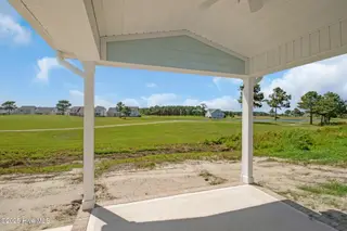 203 Windswept Lane, Beaufort, NC 28516 – photo 21: Covered Porch Overlooking Golf Course