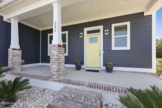 209 Bogue Carrier Court, Newport, NC 28570 – photo 2: Rocking chair front porch