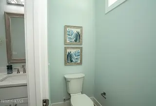137 NE 3rd Street, Oak Island, NC 28465 – photo 15: Owners Retreat Separate Area
