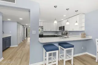 331 Salter Path Road 104 Beachwalk, Pine Knoll Shores, NC 28512 – photo 13: Updated kitchen w/ bar seating