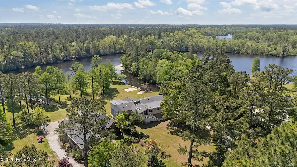244 Shoreline Drive, New Bern, NC 28562 – photo 1 of 70: 13-web-or-mls-DJI_20260414114508_0729_D
