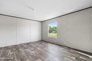 6795 Lewis Drive SE, Winnabow, NC 28479 – photo 19: Master bedroom