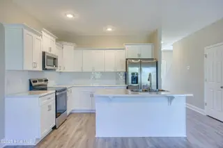218 Sandpiper Place, Holly Ridge, NC 28445 – photo 7: 218 Sand Piper - Exterior - Edited_11