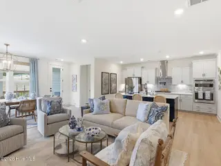 9251 Salty Breeze Place, Leland, NC 28451 — 5-bedroom home in Grand Park, Leland, NC, photo 10 of 42: Great Room to Kitchen