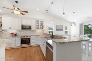 106 Wyndward Court, Emerald Isle, NC 28594 – photo 9: Kitchen with granite countertops