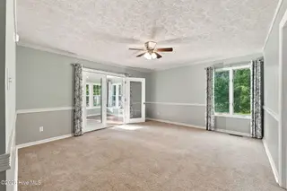 6207 Gondolier Drive, New Bern, NC 28560 – photo 18: Primary leads to sunroom