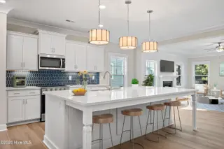 107 Spicer Lake Drive, Holly Ridge, NC 28445 – photo 3: Huge kitchen island opens to living