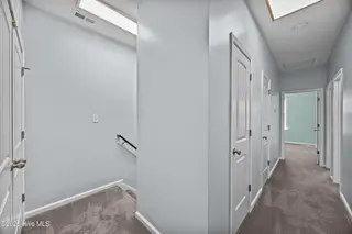 323 Cedar Island Trail, Holly Ridge, NC 28445 — 3-bedroom townhome in The Landing At Folkstone, Holly Ridge, NC, photo 19 of 36: 23_hallway