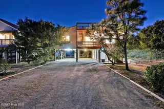 2021 W Dolphin Drive, Oak Island, NC 28465 – photo 4: 2021WestBeachDrivetwilight-1