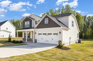 83 Tuskeegee Drive, Smithfield, NC 27577 – photo 3: 83 Tuskeegee side view 2