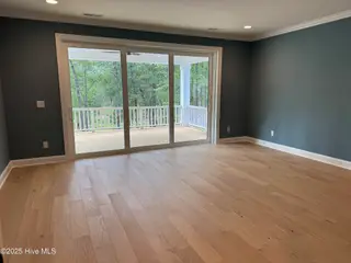 209 Coastal Dune Court, Wilmington, NC 28412 — 3-bedroom home in Riverlights, Wilmington, NC, photo 13 of 27: Upstairs Recreation Room and Porch