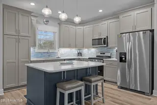 245 NE 64th Street, Oak Island, NC 28465 – photo 16: 28-web-or-mls-DSC04939
