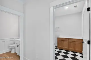2303 Chestnut Street, Wilmington, NC 28405 — 3-bedroom home in Chestnut Heights, Wilmington, NC, photo 23 of 53: Downstairs Half Bathroom & Laundry Room