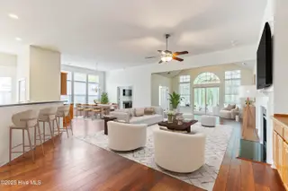 907 Corn Planters Circle, Carolina Shores, NC 28467 — 3-bedroom home in The Farm, Carolina Shores, NC, photo 11 of 77: living room, dining room, sunroom_final
