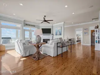 6414 Ocean Drive, Emerald Isle, NC 28594 – photo 11: Living room opens to kitchen and din