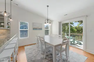 106 Wyndward Court, Emerald Isle, NC 28594 – photo 13: Dining area with deck access