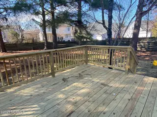 2302 Stirrup Court, Greenville, NC 27858 – photo 6: Large deck and backyard