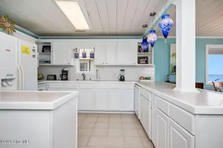 1025 W Beach Drive, Oak Island, NC 28465 – photo 16: 1025 W Beach 33
