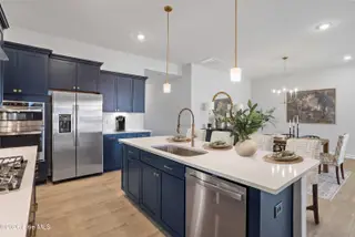 9242 Salty Breeze Place, Leland, NC 28451 — 3-bedroom home in Grand Park, Leland, NC, photo 17 of 47: Kitchen and Eat-In - Davis - Ovation at