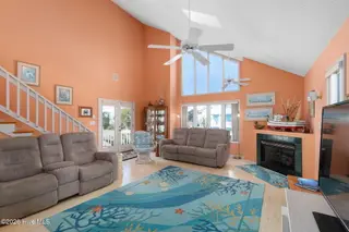 117 Island Quay Court, Atlantic Beach, NC 28512 – photo 5: Open concept Living room with fireplace