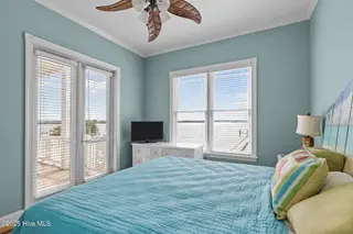 389 Live Oak Road, Newport, NC 28570 – photo 23: 19 Bedroom 3 opens to deck