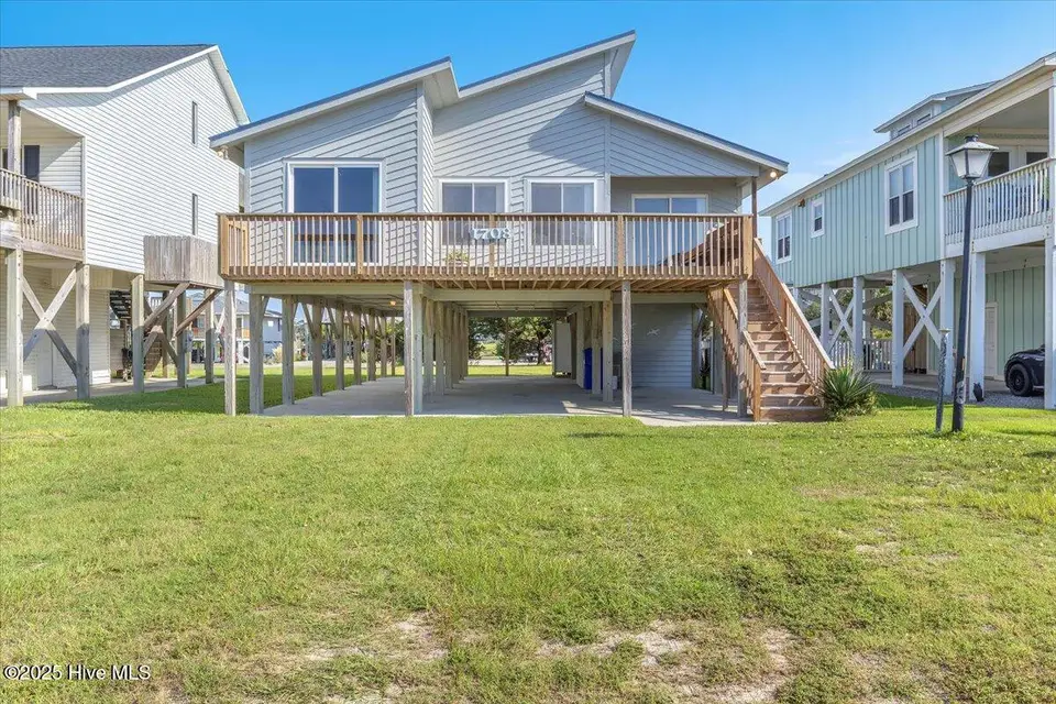 1708 W Beach Drive, Oak Island, NC 28465 – photo 1 of 62: 01-Final 1708 W Beach Dr OKI-RJREM-1945