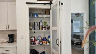1708 Oakbrook Drive SW, Ocean Isle Beach, NC 28469 – photo 16: Tasteful Bifold Door on Pantry