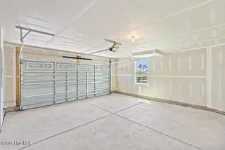 8027 Sterling Oaks Drive NW, Ash, NC 28420 – photo 17: 2 Car Garage