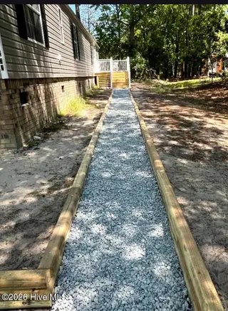232 Lake Drive SW, Supply, NC 28462 — 3-bedroom manufactured home in Riverside, Supply, NC, photo 2 of 36: Front Walkway